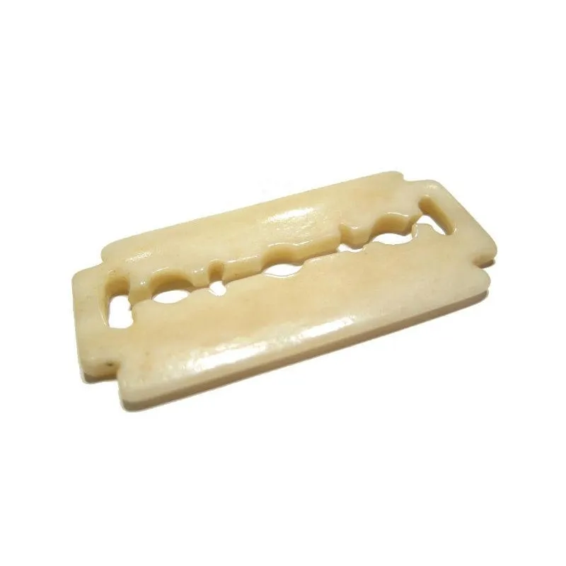 A Non-Hazardous Safety Razor Blade Hand Carved Cow Bone Pendant